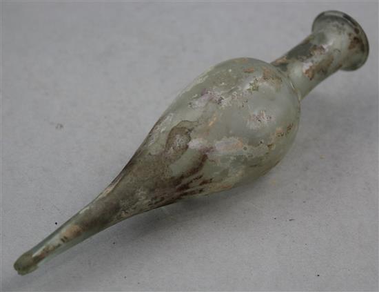A Roman clear glass spindle flask, c.2nd century AD, 20cm